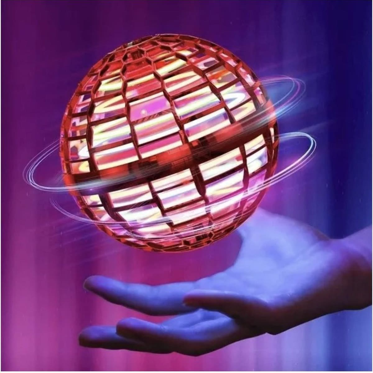Rode vliegende led-bal die boven een hand zweeft