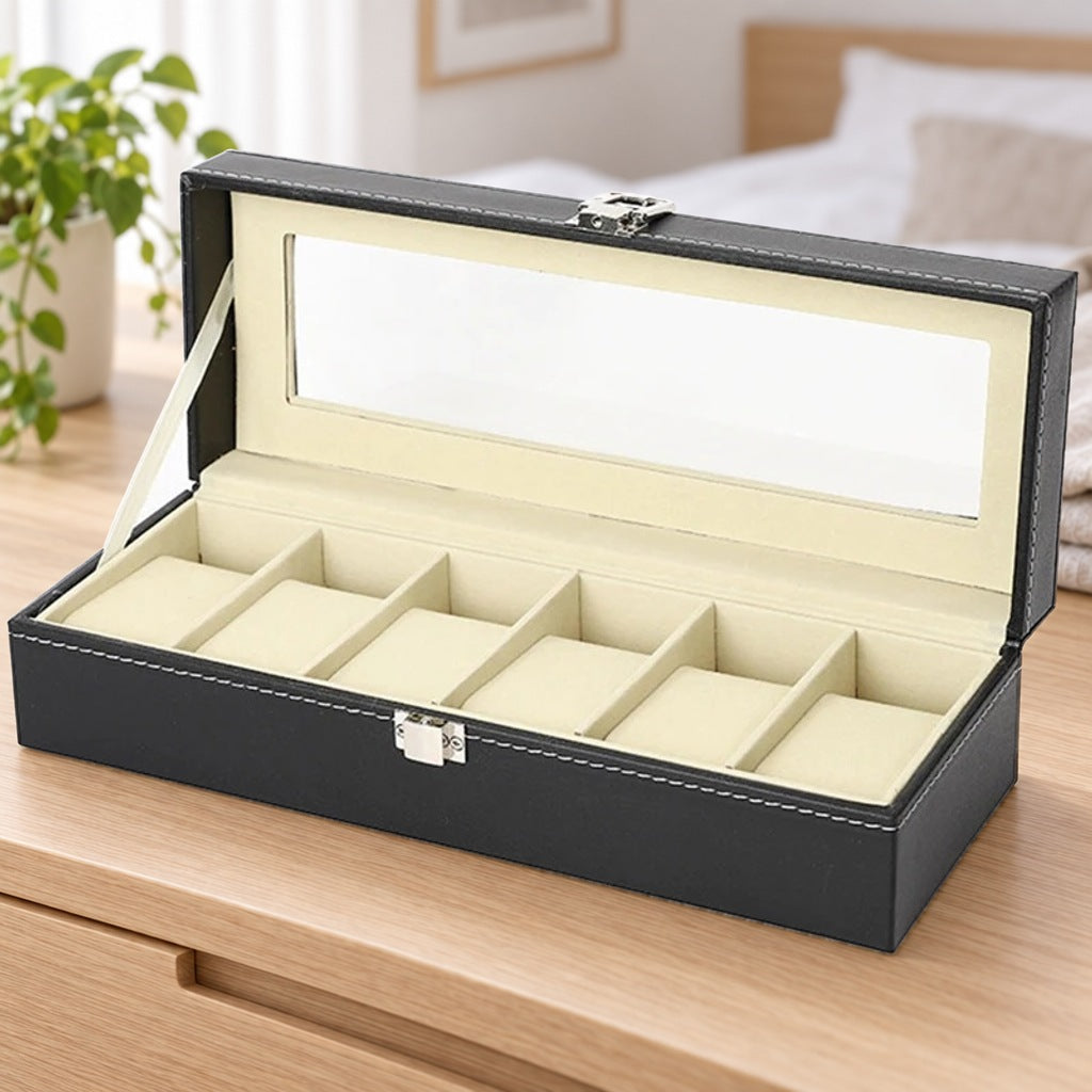 Lege horlogebox met zes kussentjes en open vensterdeksel op een lichteiken ladekast in een slaapkamer