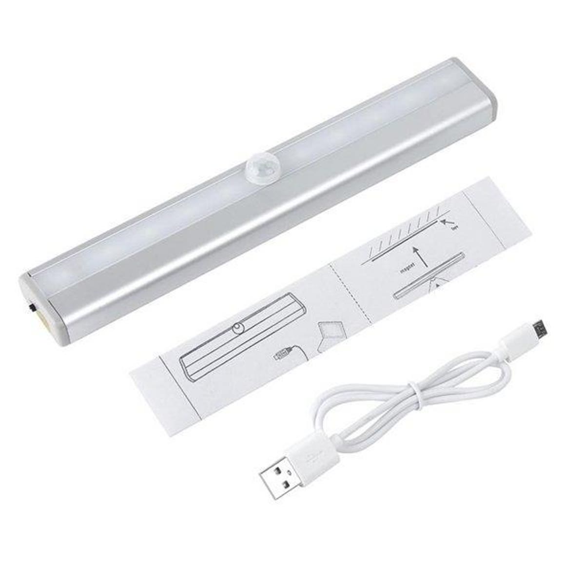 De strip met magneetplaat, tape en USB-laadkabel ernaast
