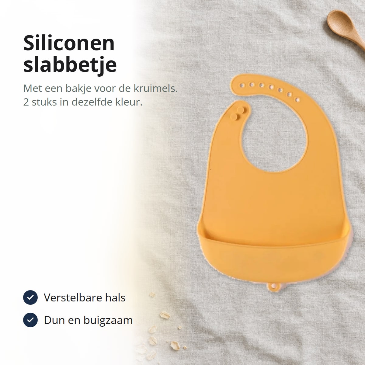 Geel siliconen slabbetje met opvangbakje op een linnen doek