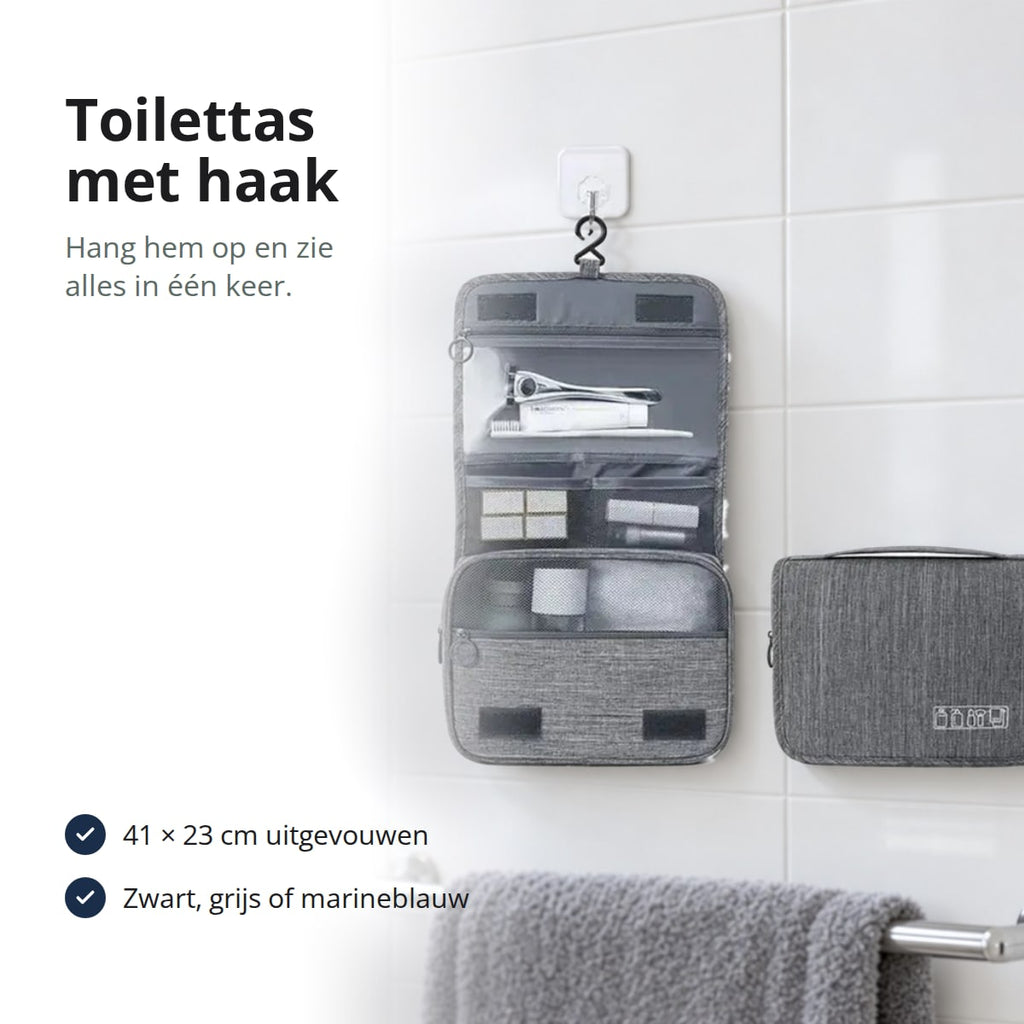 Grijze toilettas met haak, uitgevouwen en dicht, opgehangen aan een witte tegelwand boven een handdoekstang, met de tekst: 41 × 23 cm uitgevouwen, zwart, grijs of marineblauw